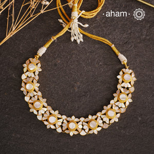 Embrace the allure of timeless elegance with Aham Jewellery’s latest Mother of Pearl collection, a radiant choice for festive celebrations and weddings.

The Neckpiece is crafted in 92.5 silver and adorned with a luxurious gold polish, capturing the iridescent beauty of mother of pearl. You can wear this versatile piece like a choker or a around the neck piece.