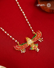 Eagle in flight crafted in 92.5 silver with kundan work and gold polish. Laced with delicate pearls and a pearl chain