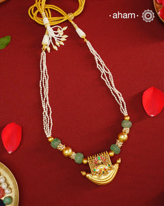 Elevate your style with our Gold Polish Amulet Silver Neckpiece. Crafted in silver and dipped in lustrous gold polish, this beautiful neckpiece features amulet with kundan work and semi-precious stones mala. Make an elegant statement with this stunning accessory.