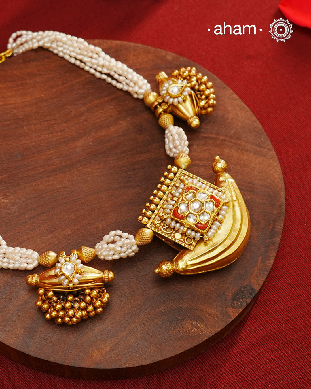 Elevate your style with our Gold Polish Amulet Silver Neckpiece. Crafted in silver and dipped in lustrous gold polish, this beautiful neckpiece features amulets with kundan work and pearl mala. Make an elegant statement with this stunning accessory.