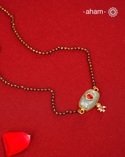 Minimal, elegant, and thoughtfully detailed, this gold-polished silver mangalsutra is designed for the contemporary woman.