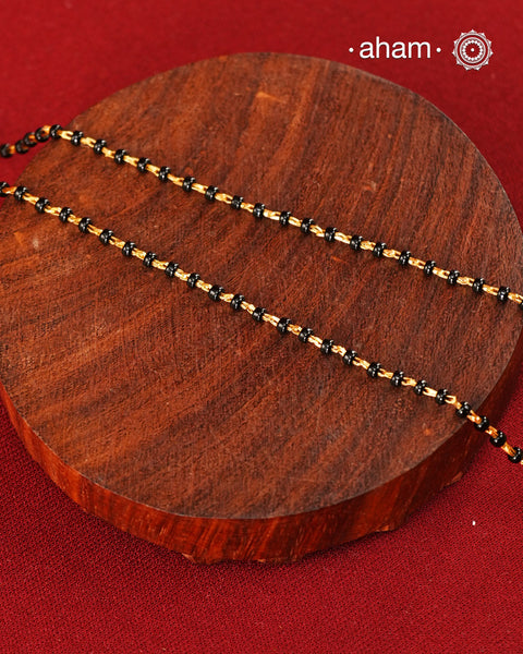 A gold-polished silver mangalsutra that is minimal in design, yet rich in fine detailing—crafted to complement modern aesthetics.