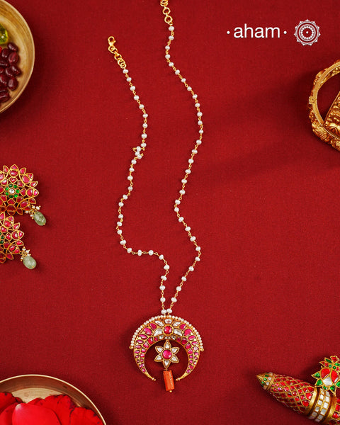 This stunning neckpiece features a delicate 92.5 silver chain with fresh water pearls and beautifully crafted fine kundan gold polished pendant. Add a touch of elegance to your look with this unique and timeless piece.