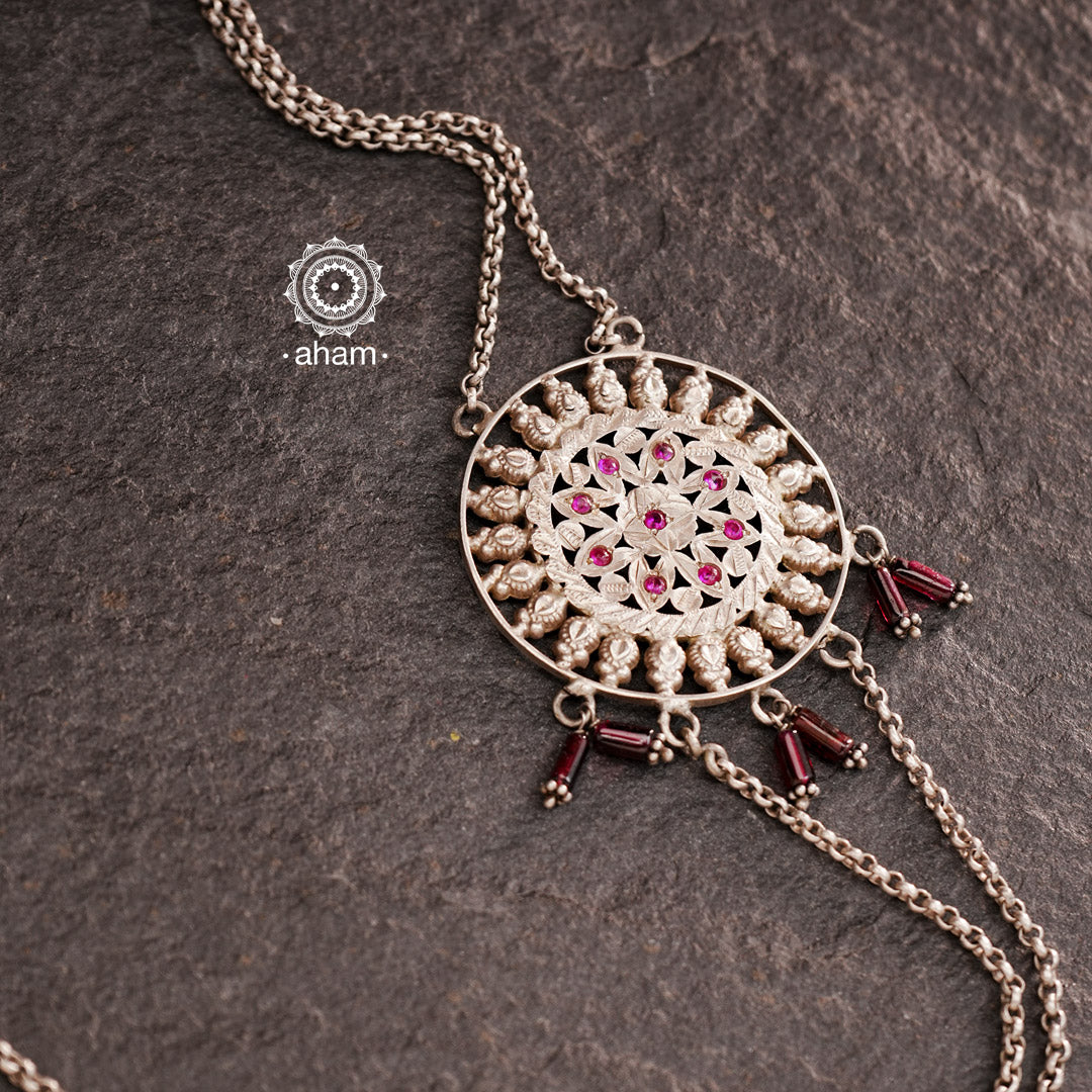 This stunning silver neckpiece features a vintage haathphool with beautiful chiali work, converted into a lightweight MOP chain that can be worn on one side. Perfect for adding a touch of elegance to any outfit.