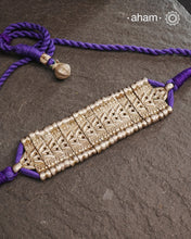 This Tribal Lotus Silver Choker exemplifies the refined craftsmanship of Orissa, skillfully handcrafted in pure silver. Featuring a stunning lotus motif, it embodies traditional artistry with a contemporary appeal. Perfect for those who value expert design and cultural heritage, this choker enhances any outfit with its elegant and distinctive presence.