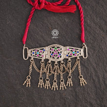 Tribal Silver Choker with
This Tribal Silver Choker features a unique design, with a silver armband transformed into a stylish choker. Adorned with beautiful chilai work and colorful stone accents, this piece adds a touch of cultural elegance to any outfit. Enhance your style with this one-of-a-kind choker.

