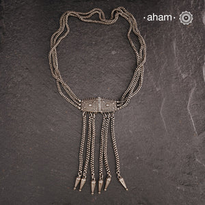 Transform your look with our Vintage Silver Belt Neckpiece. This unique accessory is crafted from a beautiful vintage belt sourced from the south of India and features fine rava work on the main buckle. Elevate any outfit with this versatile and stylish addition to your wardrobe.