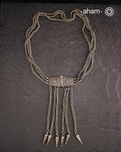 Transform your look with our Vintage Silver Belt Neckpiece. This unique accessory is crafted from a beautiful vintage belt sourced from the south of India and features fine rava work on the main buckle. Elevate any outfit with this versatile and stylish addition to your wardrobe.