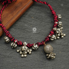 Tribal Borla Silver Neckpiece with adjustable thread.  The Rajasthani Borla - Mangtika along with beautiful trinket silver pieces has been given a new twist by threading them into a beautiful unique short neckpiece. Perfect piece to wear this Navratri. 