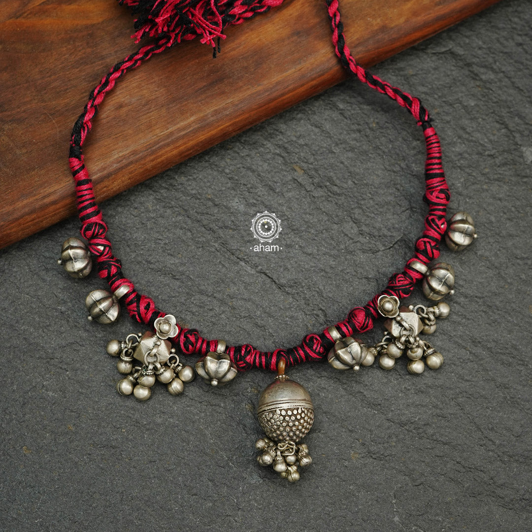 Tribal Borla Silver Neckpiece with adjustable thread.  The Rajasthani Borla - Mangtika along with beautiful trinket silver pieces has been given a new twist by threading them into a beautiful unique short neckpiece. Perfect piece to wear this Navratri. 