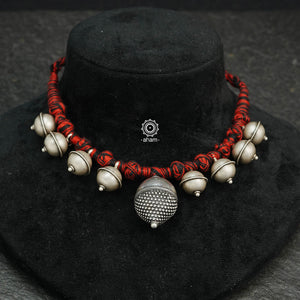 Tribal Borla Silver Neckpiece with adjustable thread.  The Rajasthani Borla - Mangtika along with beautiful trinket silver pieces has been given a new twist by threading them into a beautiful unique short neckpiece. Perfect piece to wear this Navratri. 