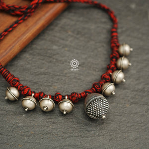 Tribal Borla Silver Neckpiece with adjustable thread.  The Rajasthani Borla - Mangtika along with beautiful trinket silver pieces has been given a new twist by threading them into a beautiful unique short neckpiece. Perfect piece to wear this Navratri. 