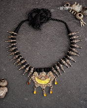 Tribal silver neckpiece with a silver glass pendant and beautiful vintage beads strung on cotton thread.