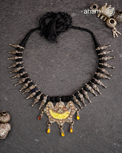 Tribal silver neckpiece with a silver glass pendant and beautiful vintage beads strung on cotton thread.