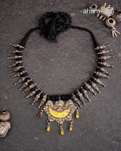 Tribal silver neckpiece with a silver glass pendant and beautiful vintage beads strung on cotton thread.