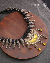 Tribal silver neckpiece with a silver glass pendant and beautiful vintage beads strung on cotton thread.