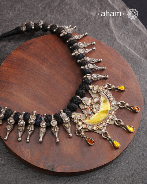Tribal silver neckpiece with a silver glass pendant and beautiful vintage beads strung on cotton thread.