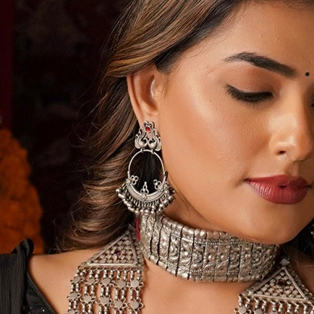 Expertly crafted vintage silver chandbali hoops featuring elegant peacock studs for effortless wearing. A timeless addition to your collection, these hoops offer a touch of tradition to any outfit.