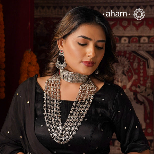 Crafted by skilled artisans, this Tribal Silver Neckpiece is a stunning addition to any jewelry collection. Its vintage design and 5 strands make it a beautiful statement piece. Made with high-quality silver, this rani haar is perfect for adding a touch of elegance to any outfit.