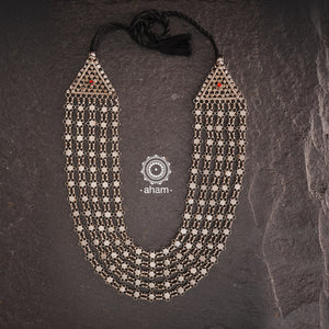 Crafted by skilled artisans, this Tribal Silver Neckpiece is a stunning addition to any jewelry collection. Its vintage design and 5 strands make it a beautiful statement piece. Made with high-quality silver, this rani haar is perfect for adding a touch of elegance to any outfit.