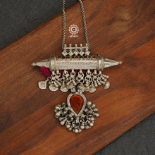 Long silver neckpiece made by putting together some unique vintage tribal silver pieces. Looks great when paired with workwear kurtas, saris or even a shirt.  Please note the glass drop is a deep yellow. 