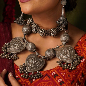 For those who enjoy and appreciate traditional tribal pieces, this one is for you. A beautiful statement neckpiece with heart shaped pendants with peacock motifs on them along side some big vintage beads and ghungroos. A stunning piece this one is.