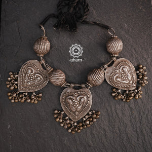 For those who enjoy and appreciate traditional tribal pieces, this one is for you. A beautiful statement neckpiece with heart shaped pendants with peacock motifs on them along side some big vintage beads and ghungroos. A stunning piece this one is.