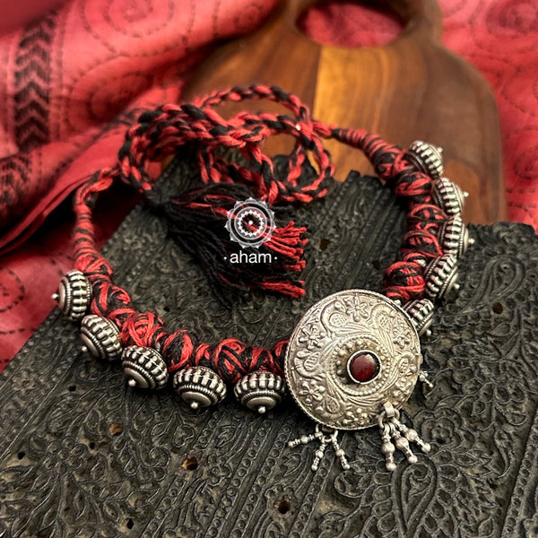 Tribal Borla Silver Neckpiece with adjustable thread.
The Rajasthani Borla - Mangtika along with beautiful trinket silver beads has been given a new twist by threading them into a beautiful unique short neckpiece. A perfect, unique piece to wear with your ethnic wear.