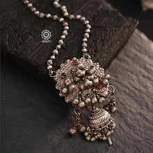 A beautiful unique neckpiece where we have used a vintage silver Pauchi and silver jhumkie to create the center pendant and added ball bead chain to it.  Perfect for those who like to keep it light yet make a statement. 