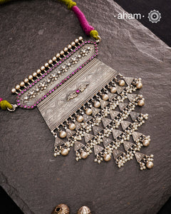 Experience the rich heritage of Rajasthan with this exquisite Aad silver neckpiece. Meticulously handcrafted in silver, it showcases traditional craftsmanship that reflects the region's cultural legacy. This neckpiece is more than jewellery—it's a timeless statement of artistry and tradition, perfect for those who appreciate authentic heritage in every detail.