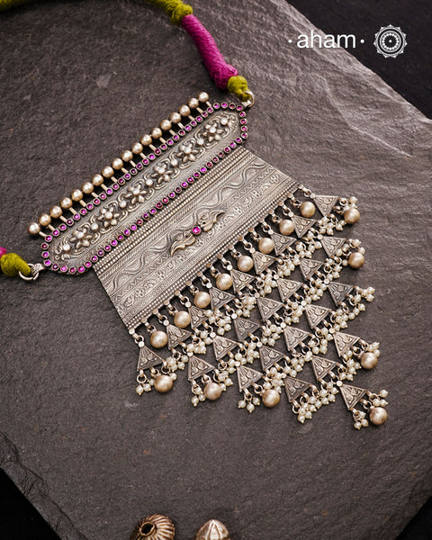 Experience the rich heritage of Rajasthan with this exquisite Aad silver neckpiece. Meticulously handcrafted in silver, it showcases traditional craftsmanship that reflects the region's cultural legacy. This neckpiece is more than jewellery—it's a timeless statement of artistry and tradition, perfect for those who appreciate authentic heritage in every detail.