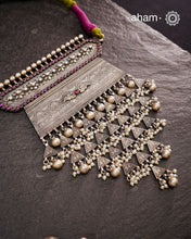Experience the rich heritage of Rajasthan with this exquisite Aad silver neckpiece. Meticulously handcrafted in silver, it showcases traditional craftsmanship that reflects the region's cultural legacy. This neckpiece is more than jewellery—it's a timeless statement of artistry and tradition, perfect for those who appreciate authentic heritage in every detail.