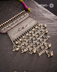 Experience the rich heritage of Rajasthan with this exquisite Aad silver neckpiece. Meticulously handcrafted in silver, it showcases traditional craftsmanship that reflects the region's cultural legacy. This neckpiece is more than jewellery—it's a timeless statement of artistry and tradition, perfect for those who appreciate authentic heritage in every detail.