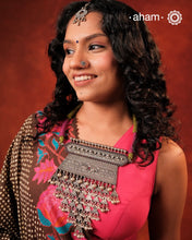 Experience the rich heritage of Rajasthan with this exquisite Aad silver neckpiece. Meticulously handcrafted in silver, it showcases traditional craftsmanship that reflects the region's cultural legacy. This neckpiece is more than jewellery—it's a timeless statement of artistry and tradition, perfect for those who appreciate authentic heritage in every detail.