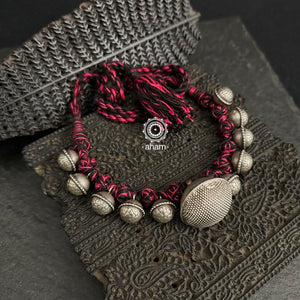 Tribal Borla Silver Neckpiece with adjustable thread.The Rajasthani Borla - Mangtika along with beautiful trinket silver beads has been given a new twist by threading them into a beautiful unique short neckpiece. A perfect, unique piece to wear with your ethnic wear.