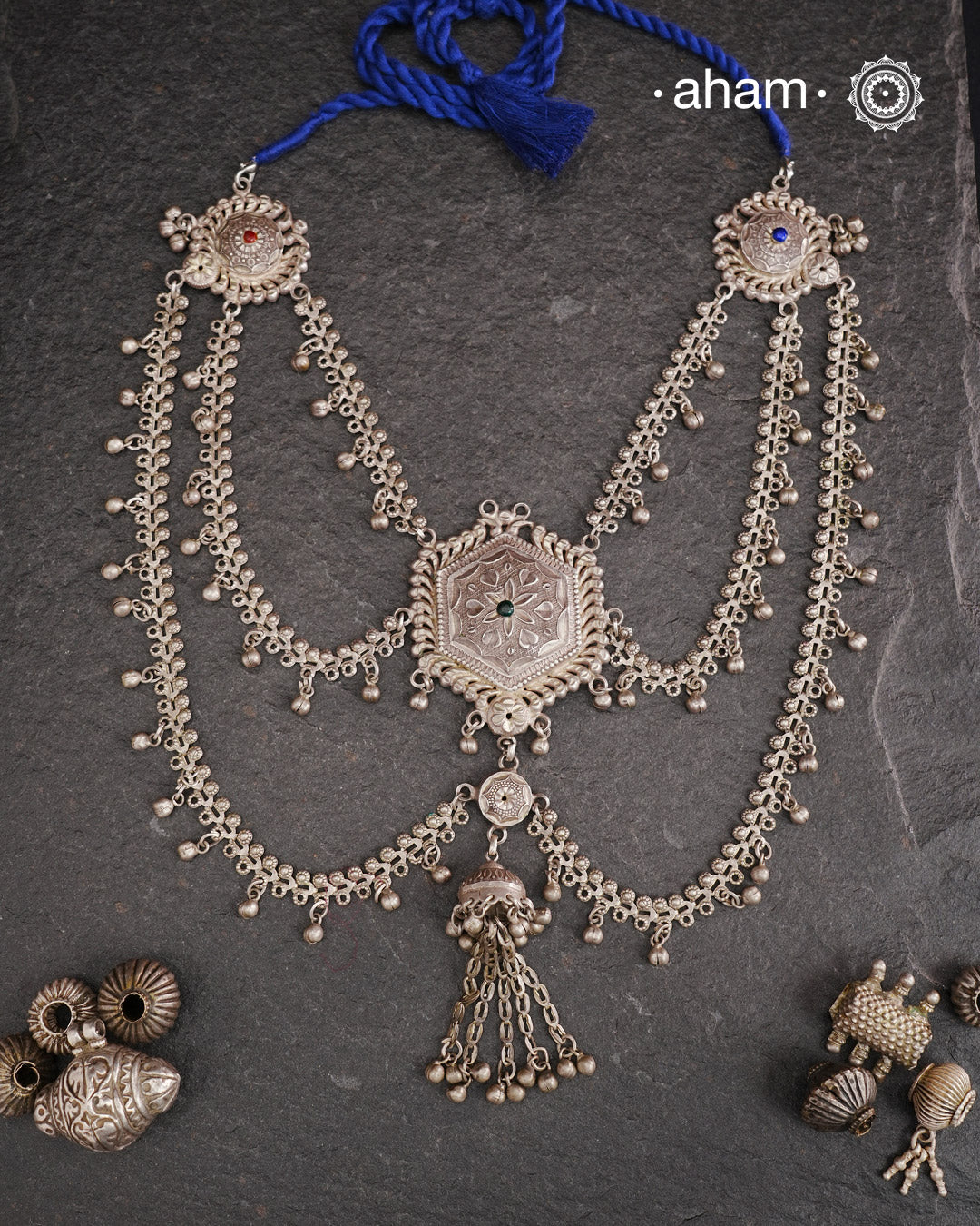 This Tribal Silver Neckpiece reimagines a classic waist belt into a stunning neckpiece, meticulously crafted from silver. Its lightweight design offers full torso coverage, creating a commanding and elegant presence. Ideal for those who appreciate traditional artistry.