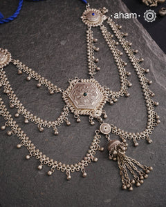 This Tribal Silver Neckpiece reimagines a classic waist belt into a stunning neckpiece, meticulously crafted from silver. Its lightweight design offers full torso coverage, creating a commanding and elegant presence. Ideal for those who appreciate traditional artistry.