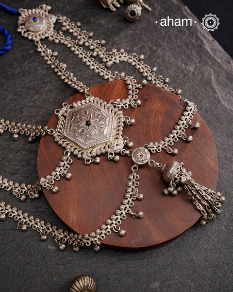 This Tribal Silver Neckpiece reimagines a classic waist belt into a stunning neckpiece, meticulously crafted from silver. Its lightweight design offers full torso coverage, creating a commanding and elegant presence. Ideal for those who appreciate traditional artistry.