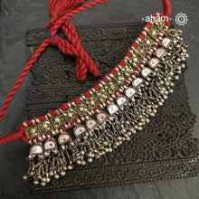 Handcrafted&nbsp;tribal Katesari silver choker from&nbsp;the state of Uttar Pradesh.
As it is a valuable ornament the Katesari choker was worn by the women mainly on festive occasions and marriage ceremonies. Each lower unit of the Katesari choker contain a foil-backed clear-glass "stone" with an auspicious red dot (tikka) in the centre. The dot is meant to denote the centre point for one's spiritual destiny and serve as a medium for personal sanctification in the Hindu mythology.