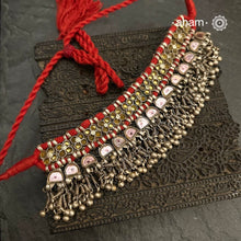 Handcrafted&nbsp;tribal Katesari silver choker from&nbsp;the state of Uttar Pradesh.
As it is a valuable ornament the Katesari choker was worn by the women mainly on festive occasions and marriage ceremonies. Each lower unit of the Katesari choker contain a foil-backed clear-glass "stone" with an auspicious red dot (tikka) in the centre. The dot is meant to denote the centre point for one's spiritual destiny and serve as a medium for personal sanctification in the Hindu mythology.