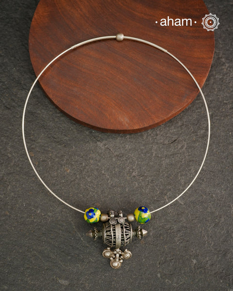 Beautiful silver hasli with a vintage looking pendant along with jaipur blue pottery beads. Easy to wear, looks great with Indian and Western outfits. The Hasli is easily removable and can be used with any other pendant as well.&nbsp;