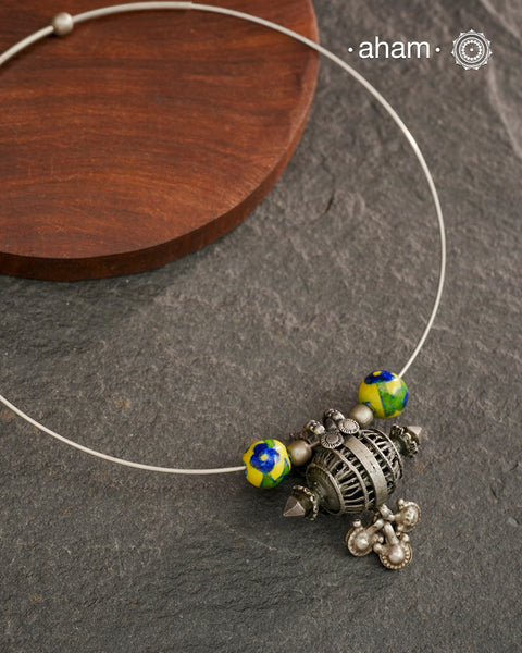 Beautiful silver hasli with a vintage looking pendant along with jaipur blue pottery beads. Easy to wear, looks great with Indian and Western outfits. The Hasli is easily removable and can be used with any other pendant as well. 