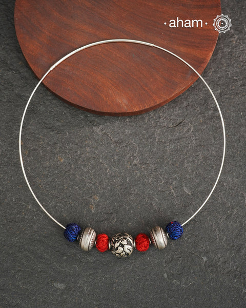 Everyday Wear Silver Pendant in 92.5 silver in Wire Hasli and three beautiful silver balls interspersed with bright cotton balls. Easy to wear, looks great with Indian and Western outfits. The Hasli is easily removable and can be used with any other pendant as well.