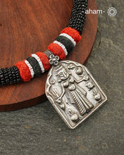 Discover the charm of traditional craftsmanship with our Handmade Karni Devi Mata 92.5 Sterling Silver Pendant on a beautiful cotton cord.&nbsp;
Expertly crafted using the thapi (stamp die) technique, this pendant reflects the age-old artistry of India’s tribal communities. Known by various names like Kavach, Mandaliya, Patri, and Kathla, amulet pendants have long been cherished as symbols of passive worship—a way to keep your deity, Kuldevta, or Kuldevi close to your heart. 