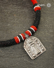 Discover the charm of traditional craftsmanship with our Handmade Karni Devi Mata 92.5 Sterling Silver Pendant on a beautiful cotton cord.&nbsp;
Expertly crafted using the thapi (stamp die) technique, this pendant reflects the age-old artistry of India’s tribal communities. Known by various names like Kavach, Mandaliya, Patri, and Kathla, amulet pendants have long been cherished as symbols of passive worship—a way to keep your deity, Kuldevta, or Kuldevi close to your heart. 