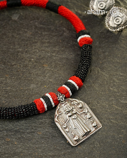 Discover the charm of traditional craftsmanship with our Handmade Karni Devi Mata 92.5 Sterling Silver Pendant on a beautiful cotton cord.&nbsp;
Expertly crafted using the thapi (stamp die) technique, this pendant reflects the age-old artistry of India’s tribal communities. Known by various names like Kavach, Mandaliya, Patri, and Kathla, amulet pendants have long been cherished as symbols of passive worship—a way to keep your deity, Kuldevta, or Kuldevi close to your heart. 