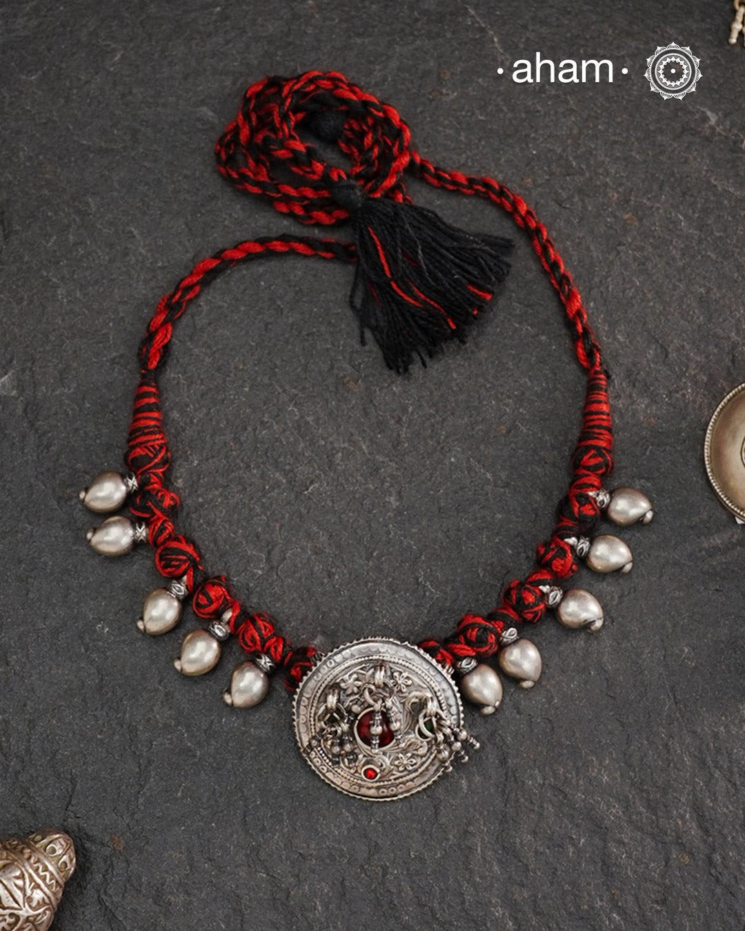Tribal Borla Silver Neckpiece with adjustable thread.
The Rajasthani Borla/Mangtika along with beautiful trinket silver beads has been given a new twist by threading them into a beautiful unique short neckpiece. A perfect, unique piece to wear with your ethnic wear.