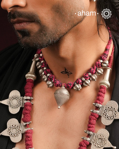 Tribal Borla Silver Neckpiece with adjustable thread. 
The Rajasthani Borla - Mangtika along with beautiful trinket silver beads has been given a new twist by threading them into a beautiful unique short neckpiece. A perfect, unique piece to wear with your ethnic wear