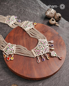 Experience the cultural elegance with our Vintage Tribal Silver Neckpiece. Adorned with intricate chilai work, it boasts a stunning vintage design. Made for those who appreciate traditional craftsmanship, this neckpiece adds a touch of sophisticated charm to any outfit. Embrace the heritage and elevate your style.
