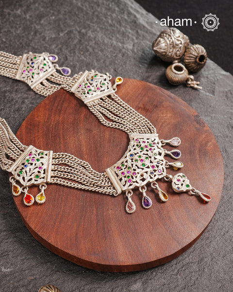 Experience the cultural elegance with our Vintage Tribal Silver Neckpiece. Adorned with intricate chilai work, it boasts a stunning vintage design. Made for those who appreciate traditional craftsmanship, this neckpiece adds a touch of sophisticated charm to any outfit. Embrace the heritage and elevate your style.